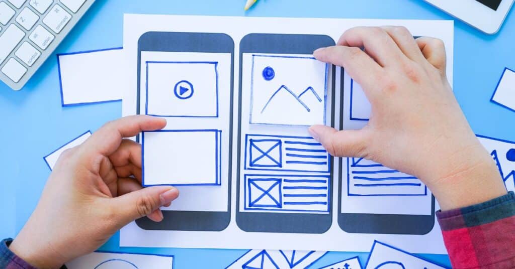 Website redesign guide - person moving pieces of website around
