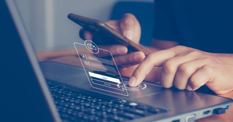 Person on computer and phone with a login screen projected in front