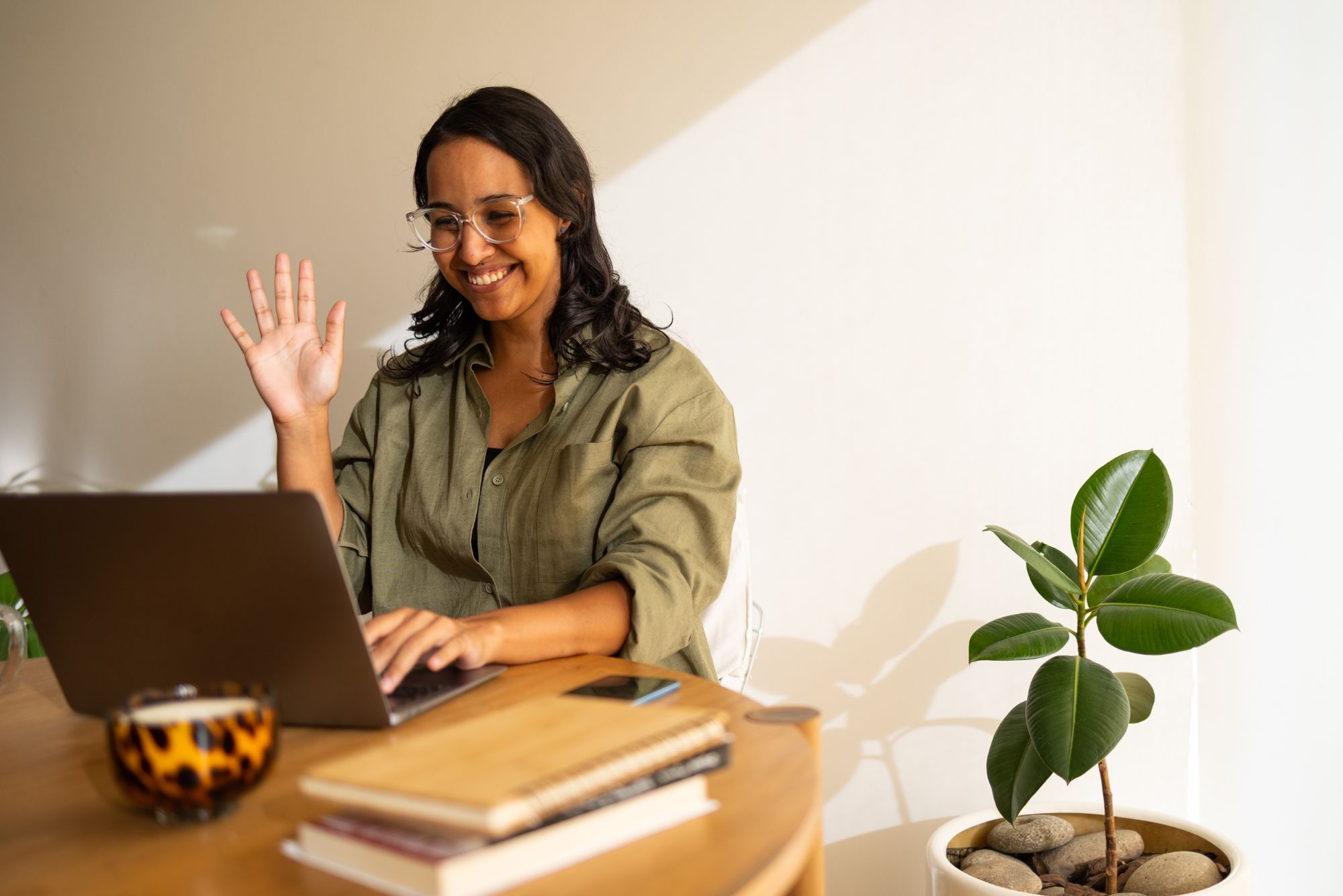 Woman sitting at a computer having a meeting